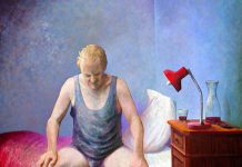 Man sitting on a bed