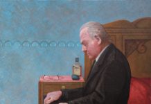 Op bedrand zittende man sept. 2011